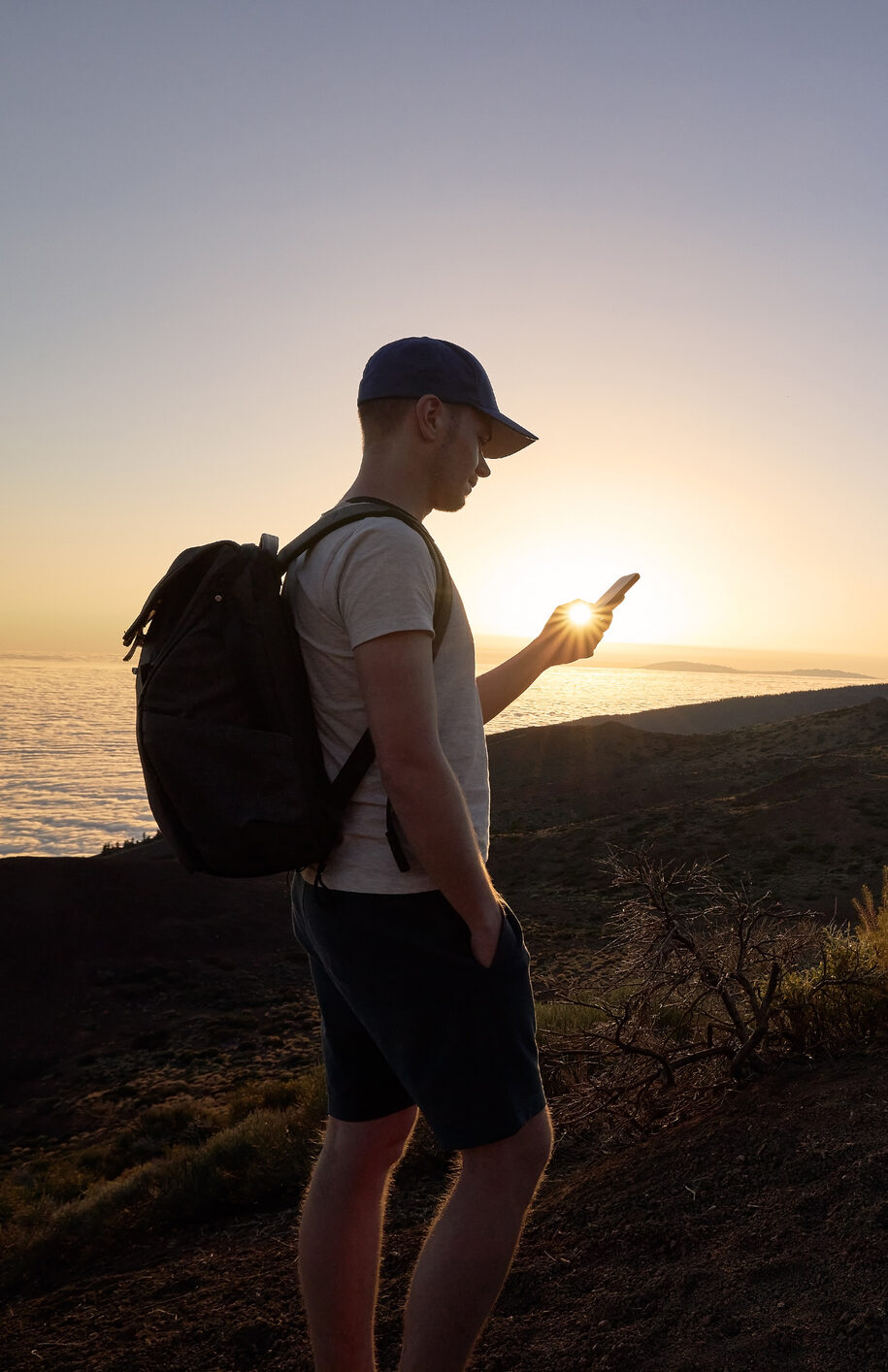 Image of a hiker using his phone