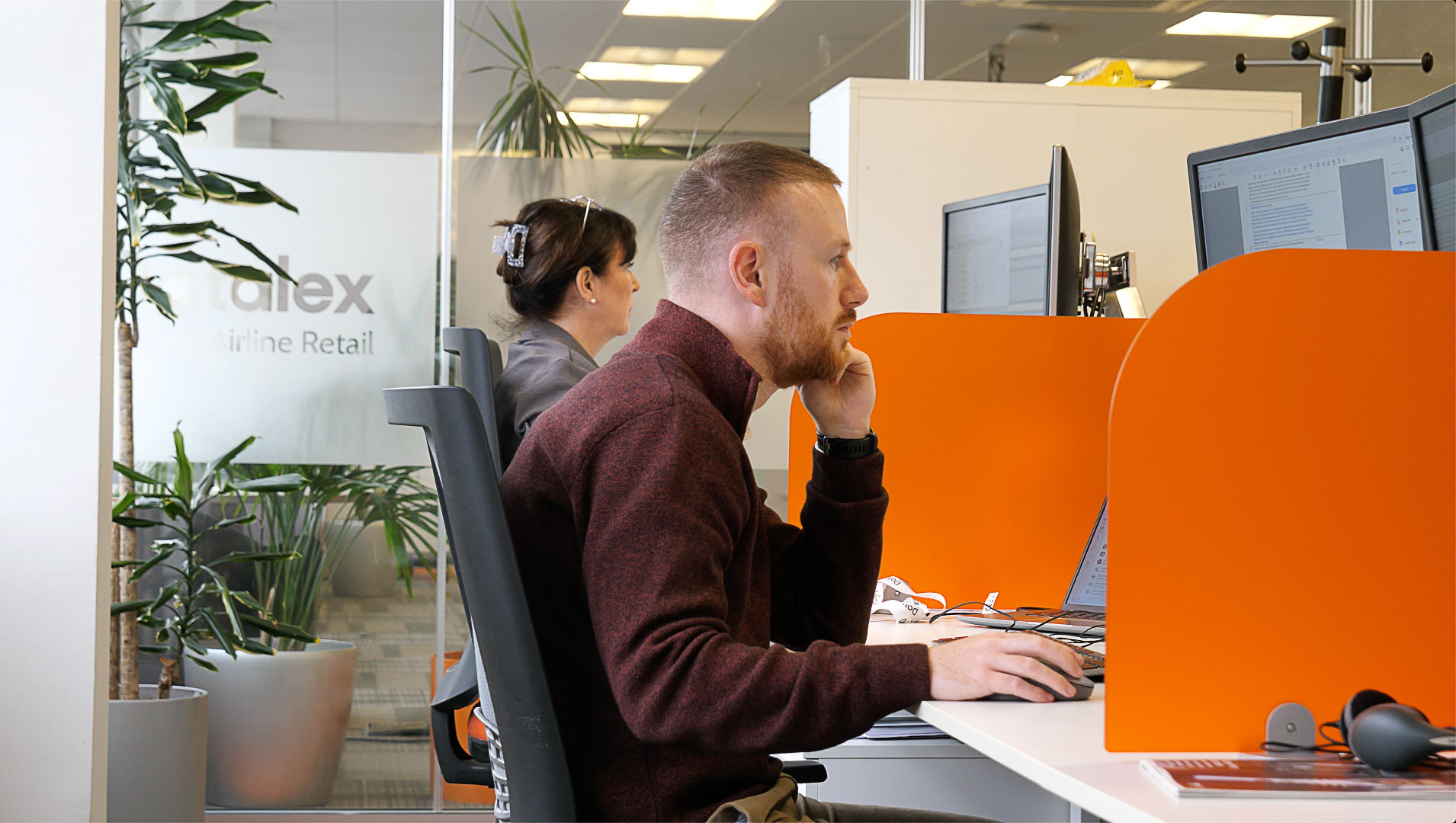 Two employees working in an office